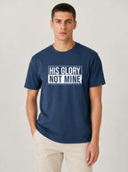 Man wearing navy His Glory Not Mine Comfort Colors t-shirt