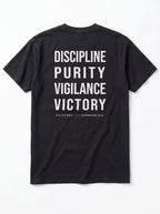Back of a black T-shirt laid flat, reading “Discipline Purity Vigilance Victory” and “Overcome // 1 Corinthians 9:25.”