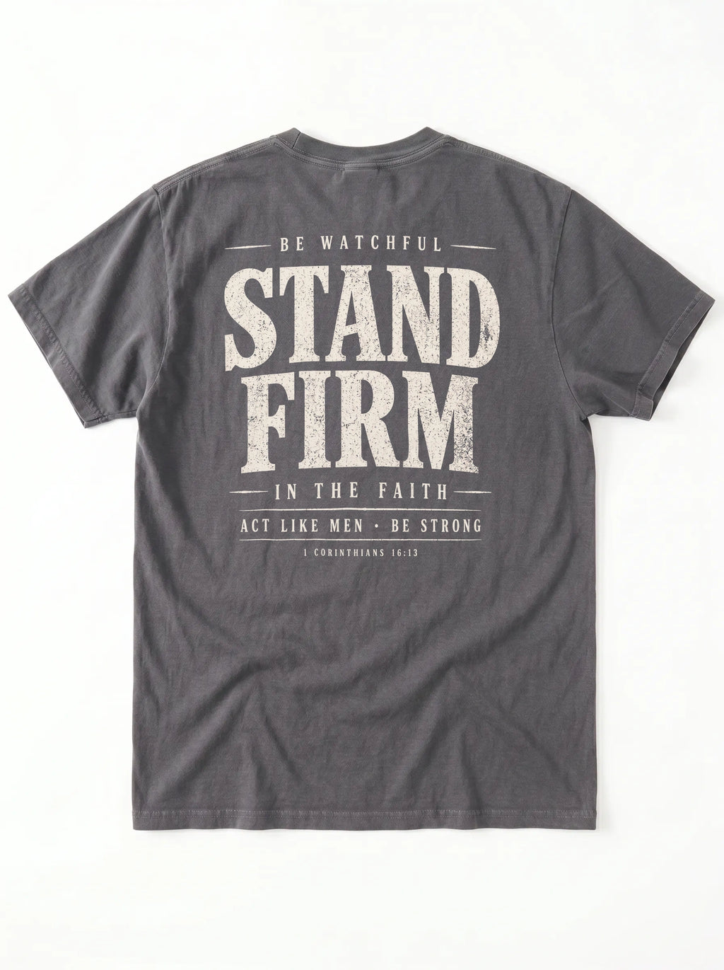 A dark gray crewneck t-shirt shown from the back, featuring a distressed white graphic print with the words 'STAND FIRM' and smaller inspirational text.