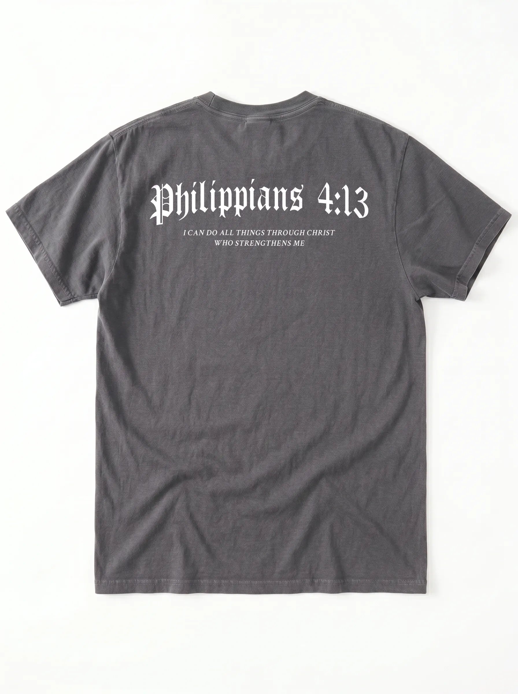 A dark gray t-shirt shown from the back, featuring the text 'Philippians 4:13' in a white gothic font, with smaller text underneath reading 'I CAN DO ALL THINGS THROUGH CHRIST WHO STRENGTHENS ME'.