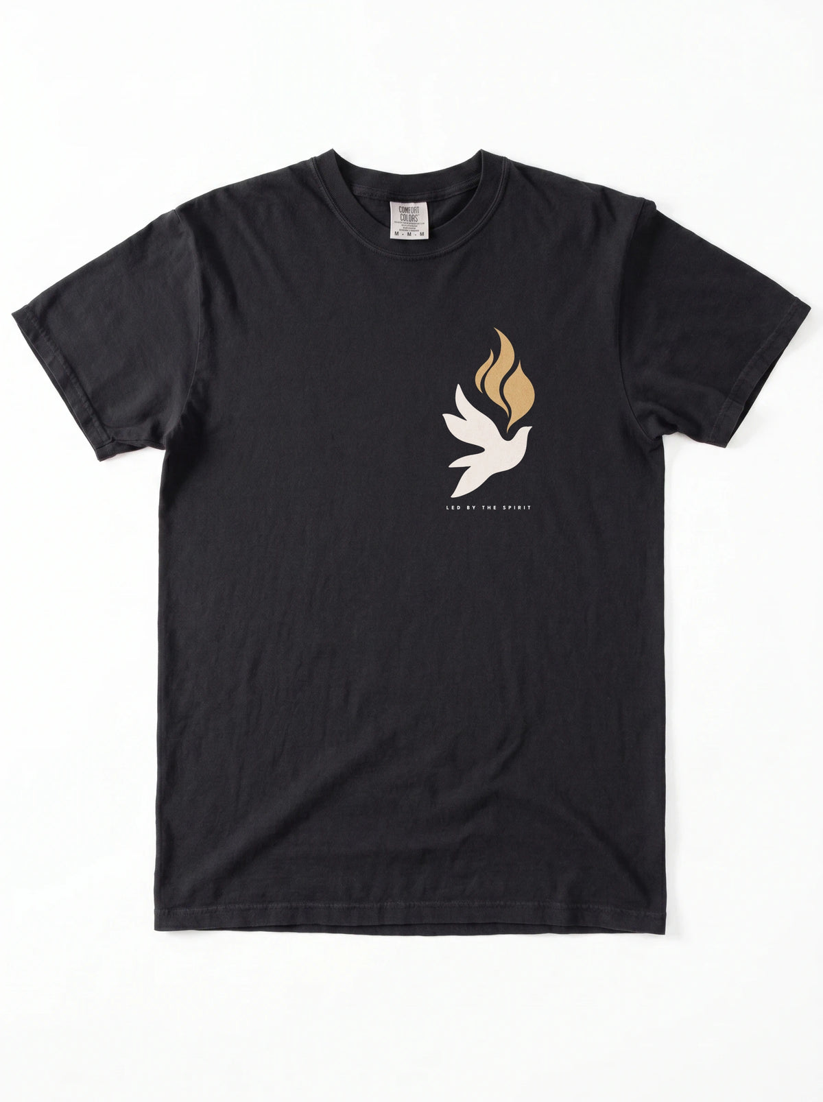 Black T-shirt laid flat with a small white dove, gold flames, and “LED BY THE SPIRIT” on the chest.