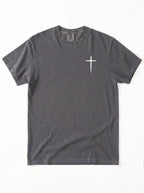 A dark gray crewneck t-shirt with a white cross on the chest, laid flat against a white background.