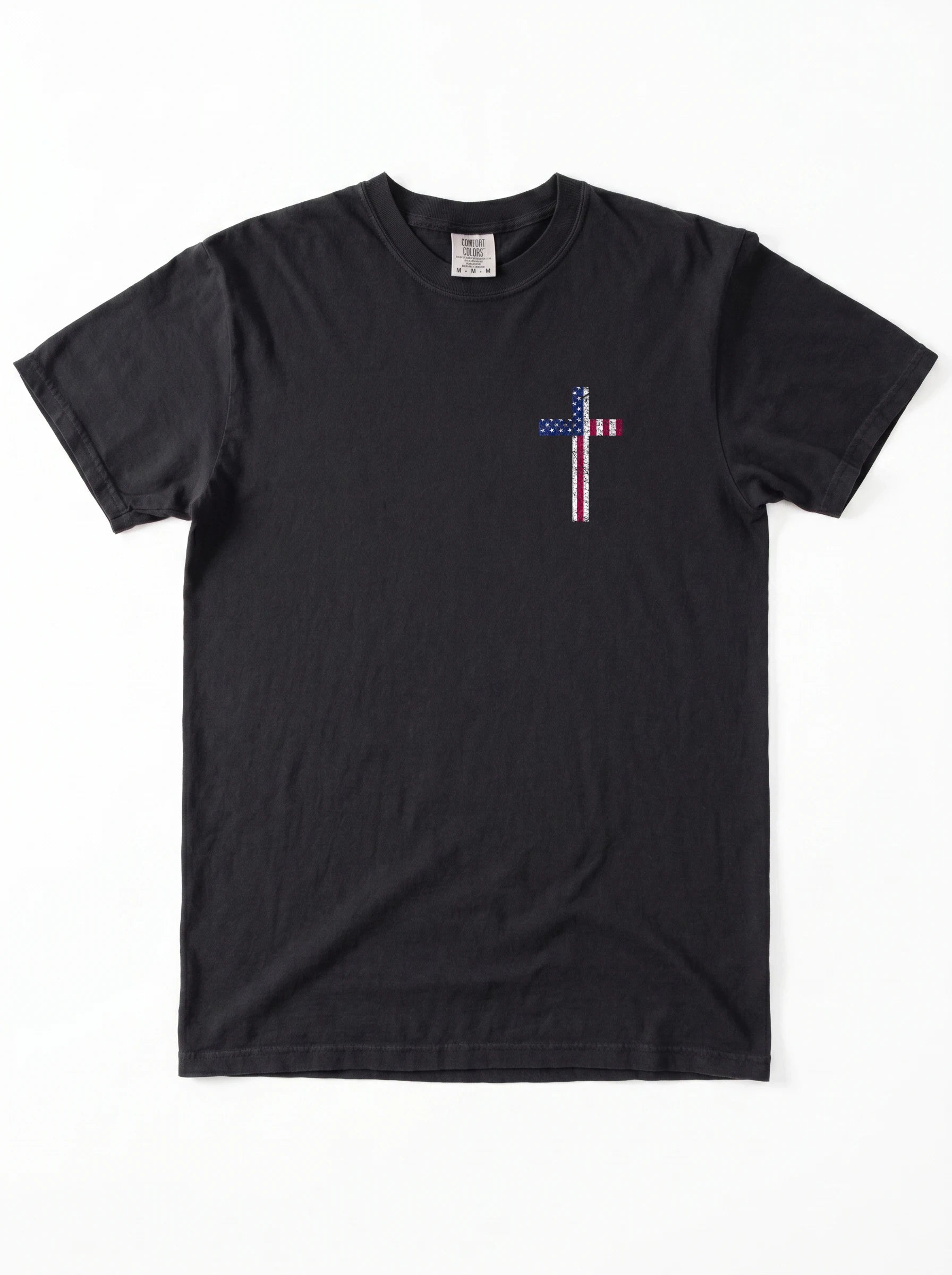 A black short-sleeve crewneck t-shirt with a small cross-shaped American flag graphic on the left chest, displayed flat against a white background.