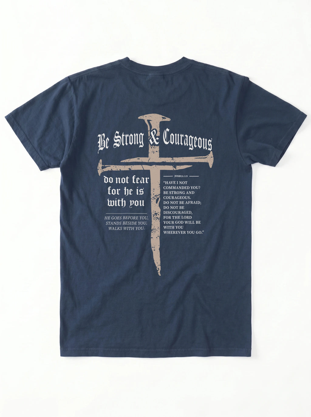 A navy blue short-sleeve t-shirt shown from the back, featuring a large graphic print with a cross, the words 'Be Strong & Courageous', and Bible verses printed in white and light gray.