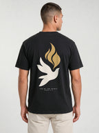 Person wearing a black T-shirt with a large white dove, gold flames, and “LED BY THE SPIRIT ROMANS 8:14” on the back.