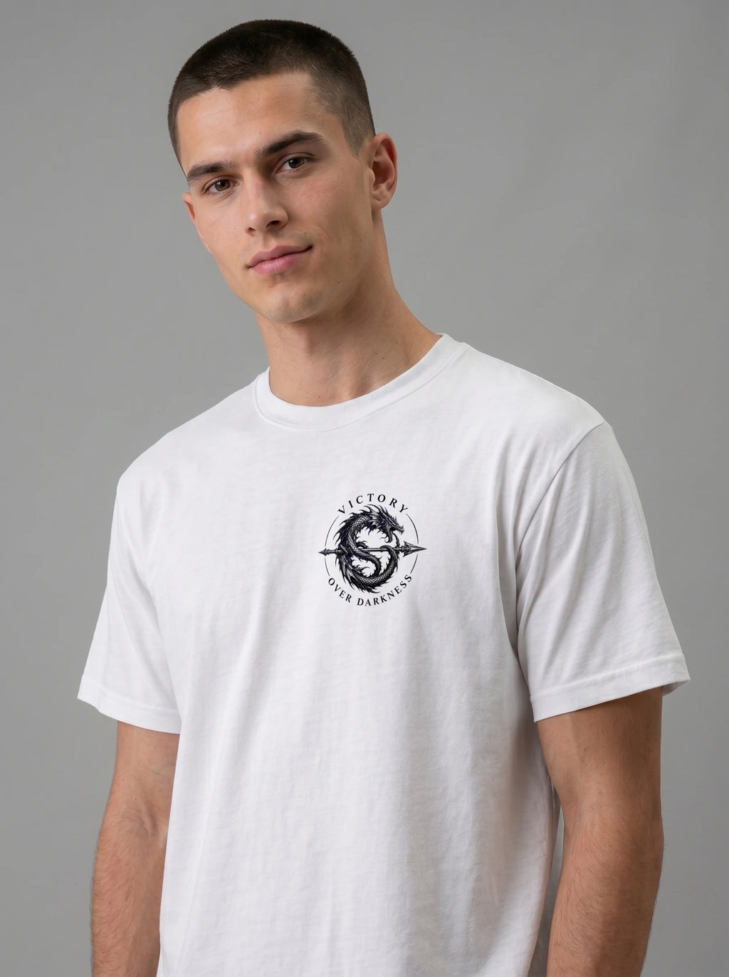 White T-shirt with a small circular dragon graphic and the text “VICTORY OVER DARKNESS” on the chest.