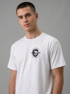 White T-shirt with a small circular dragon graphic and the text “VICTORY OVER DARKNESS” on the chest.