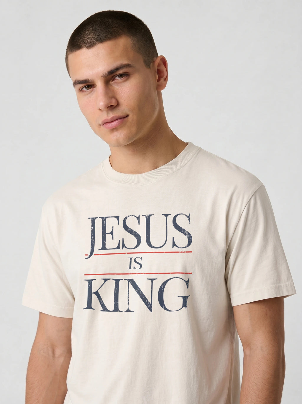 Close-up of cream Jesus Is King Comfort Colors t-shirt graphic tee