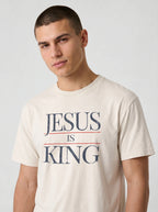 Close-up of cream Jesus Is King Comfort Colors t-shirt graphic tee