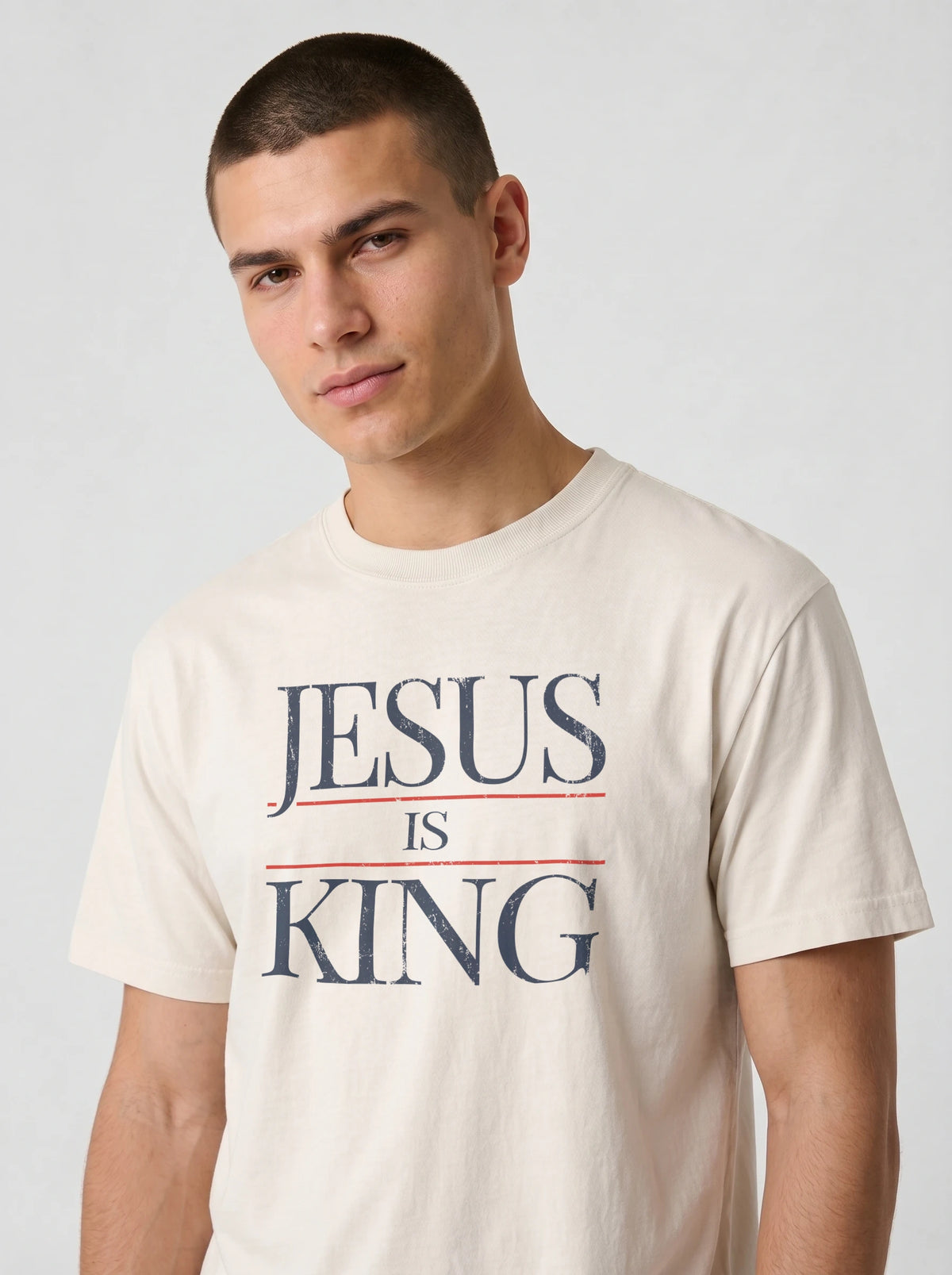 Close-up of cream Jesus Is King Comfort Colors t-shirt graphic tee