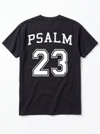 Flat lay of black Comfort Colors t-shirt, back view with Psalm 23 varsity graphic print