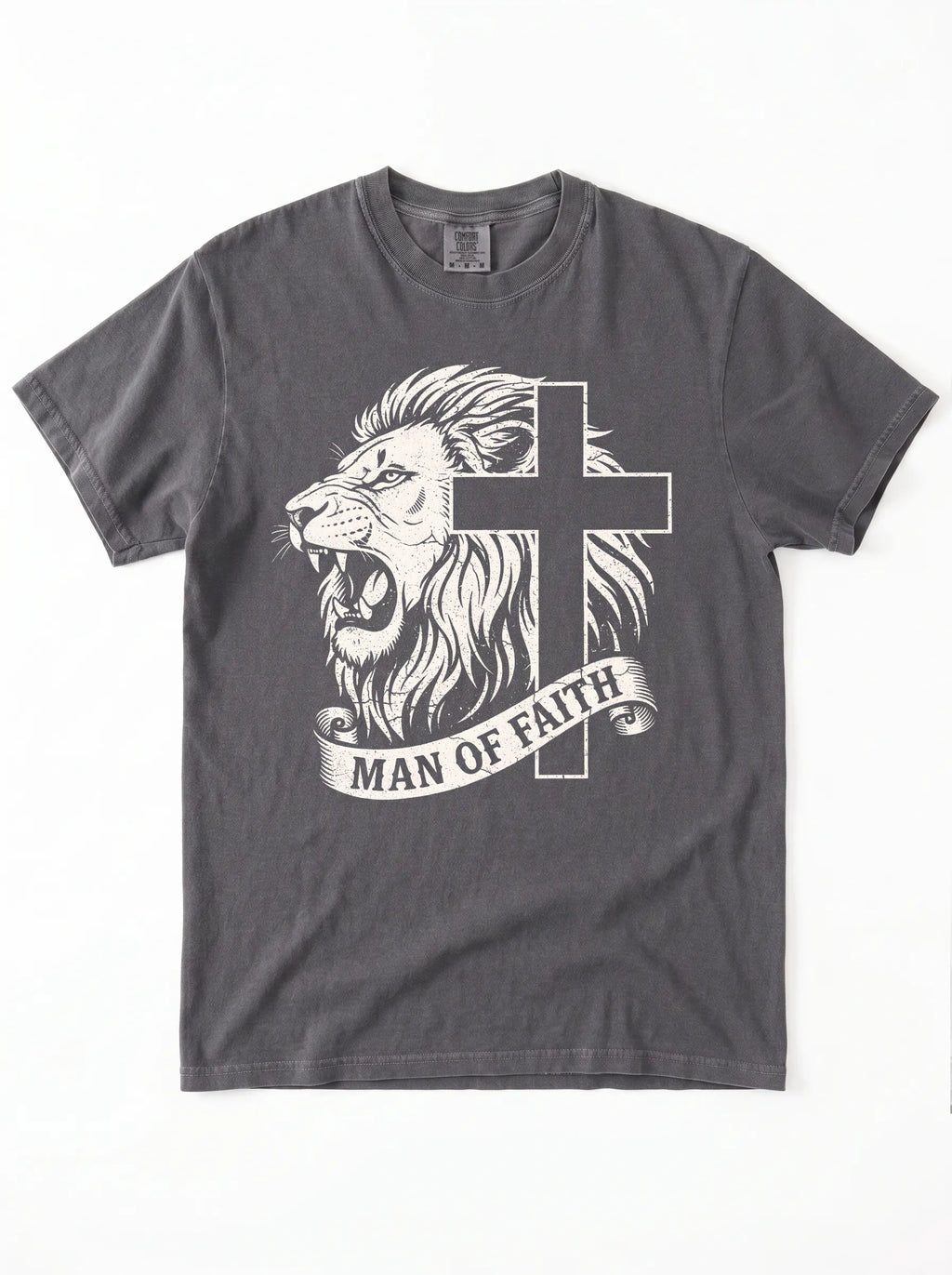 A dark gray crewneck t-shirt featuring a graphic print of a roaring lion and a cross, with a banner below reading 'MAN OF FAITH' in white text, shown flat against a white background.