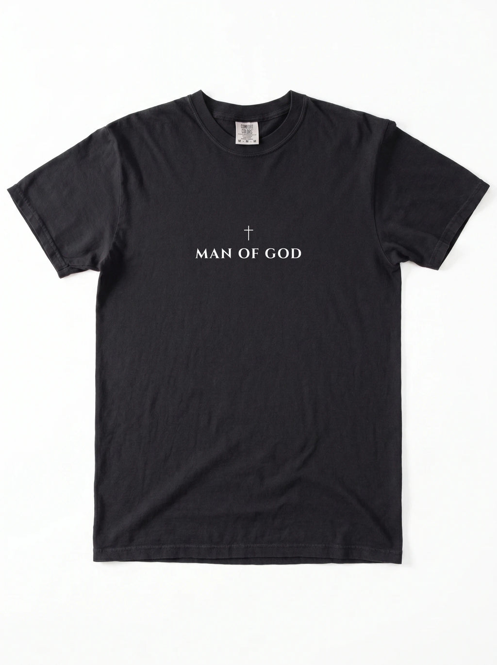 Black T-shirt laid flat with a small cross above the text “Man of God.”