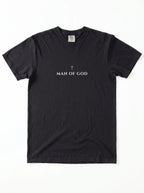 Black T-shirt laid flat with a small cross above the text “Man of God.”
