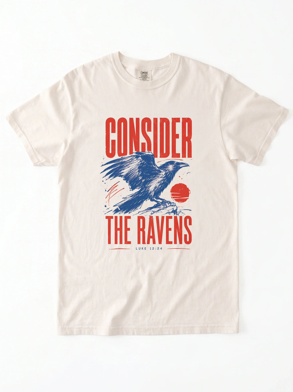 An off-white crewneck t-shirt featuring a graphic print of a blue raven and red text that reads 'CONSIDER THE RAVENS'.