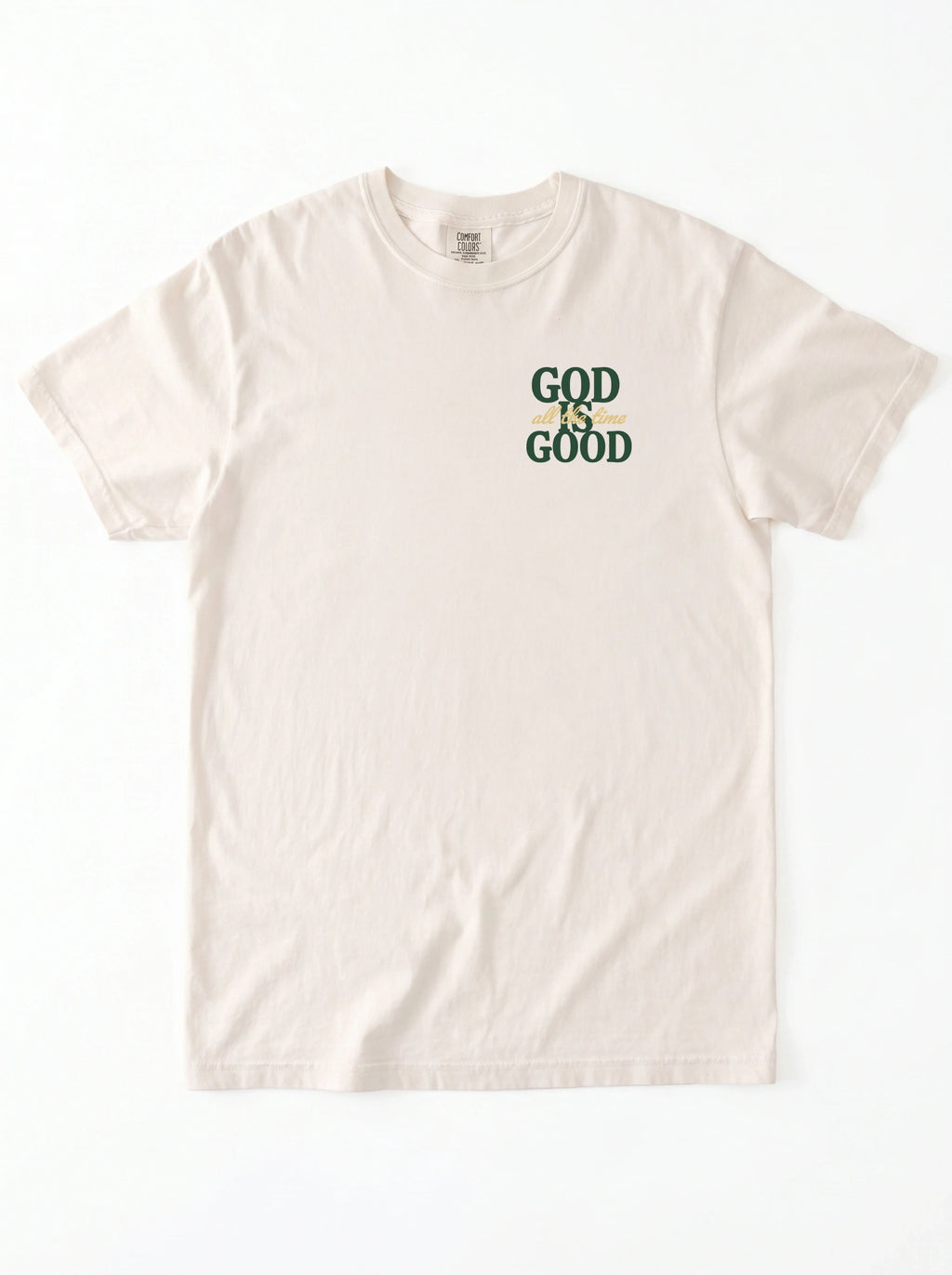 An off-white short-sleeve t-shirt with a graphic on the left chest that reads 'GOD IS GOOD' in dark green and yellow.