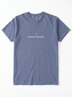 Faded blue T-shirt laid flat with a small cross above the text “Walk Steady.”