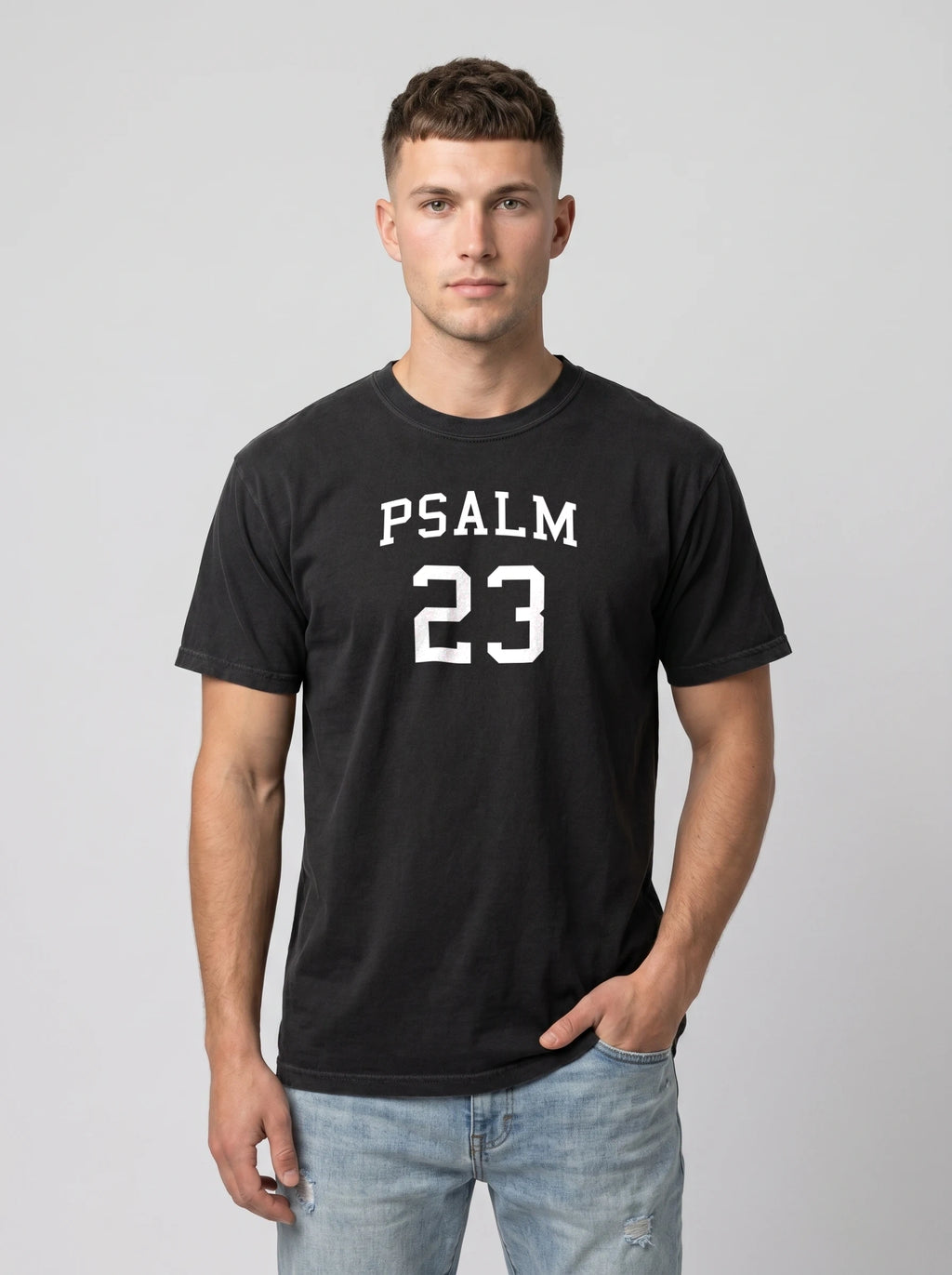 Man wearing black t-shirt with Psalm 23 collegiate print on the front, Comfort Colors graphic tee