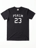 Flat lay of black Comfort Colors t-shirt, front view with Psalm 23 varsity graphic print
