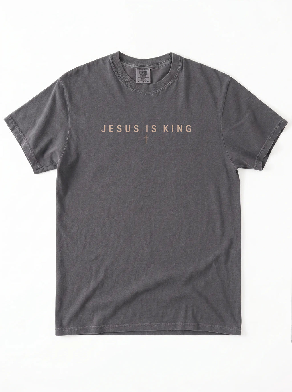 Faded charcoal T-shirt laid flat with “Jesus Is King” and a small cross printed across the chest.