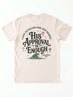 Flat lay back view of cream Comfort Colors t-shirt with 'His Approval Is Enough' Galatians 1:10 graphic and cross and wave design