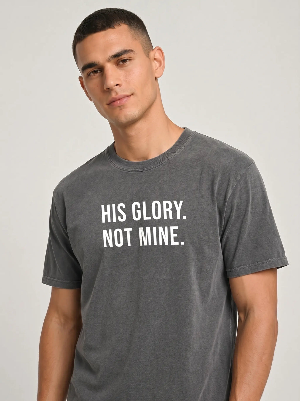 Close-up of charcoal gray Comfort Colors t-shirt front print reading 'His Glory. Not Mine.'