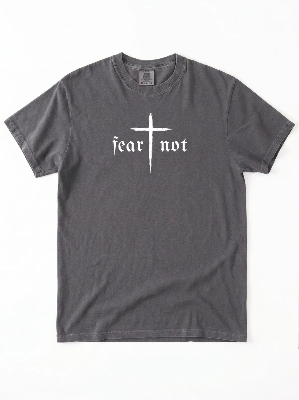 A dark gray crewneck t-shirt featuring a white graphic on the chest with a cross and the gothic text 'fear not'.