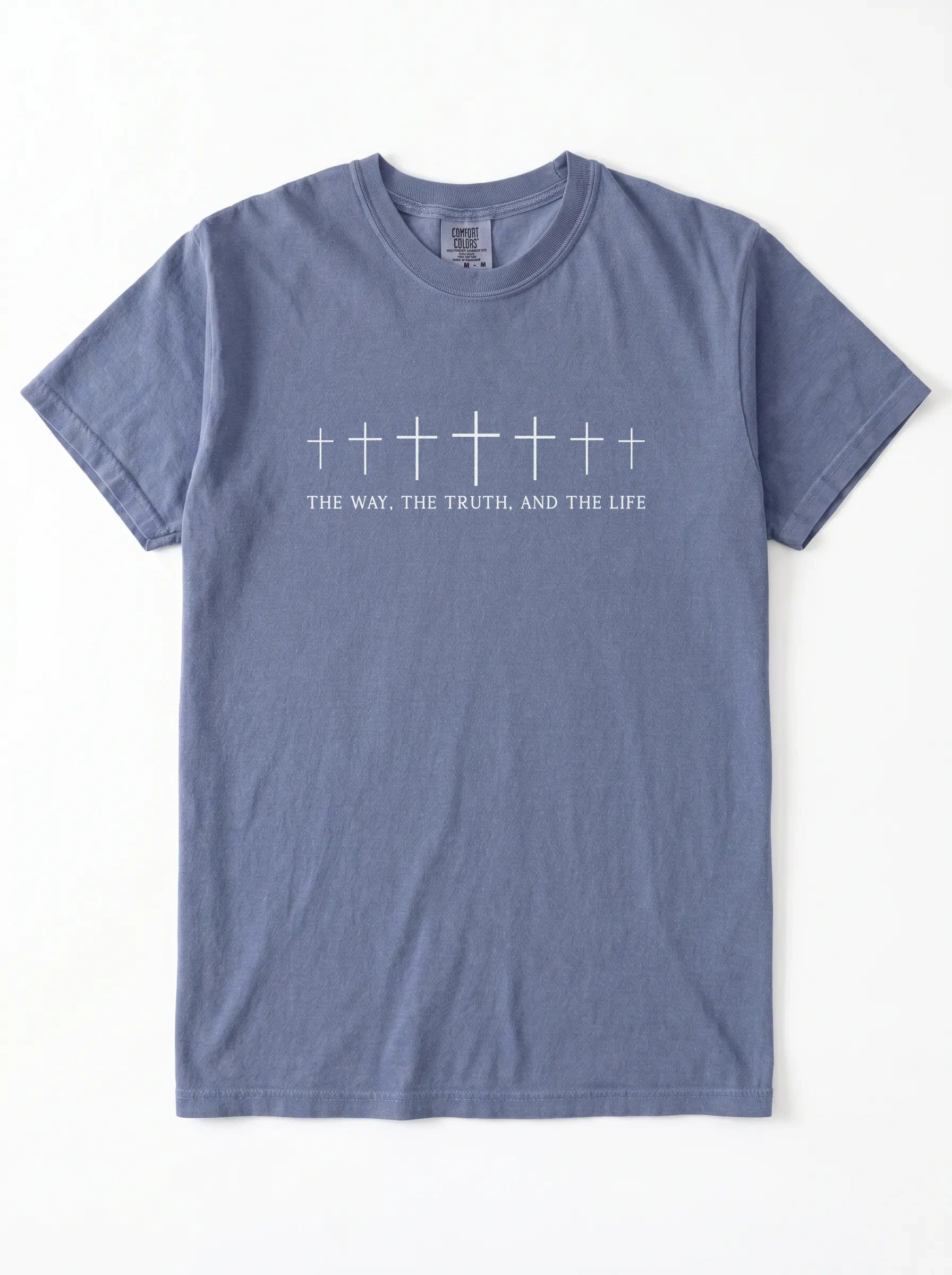 A slate blue crewneck t-shirt with a white graphic of seven crosses in various sizes and the text 'THE WAY, THE TRUTH, AND THE LIFE' printed on the chest, displayed flat against a white background.