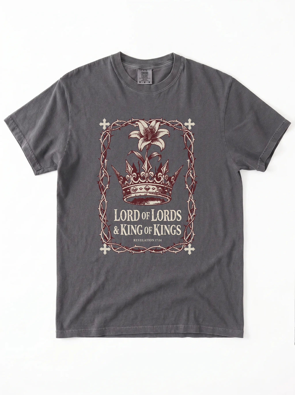 A dark gray crewneck t-shirt featuring a graphic print of a crown, a lily flower, and the text 'LORD OF LORDS & KING OF KINGS' in a distressed, vintage-style design.