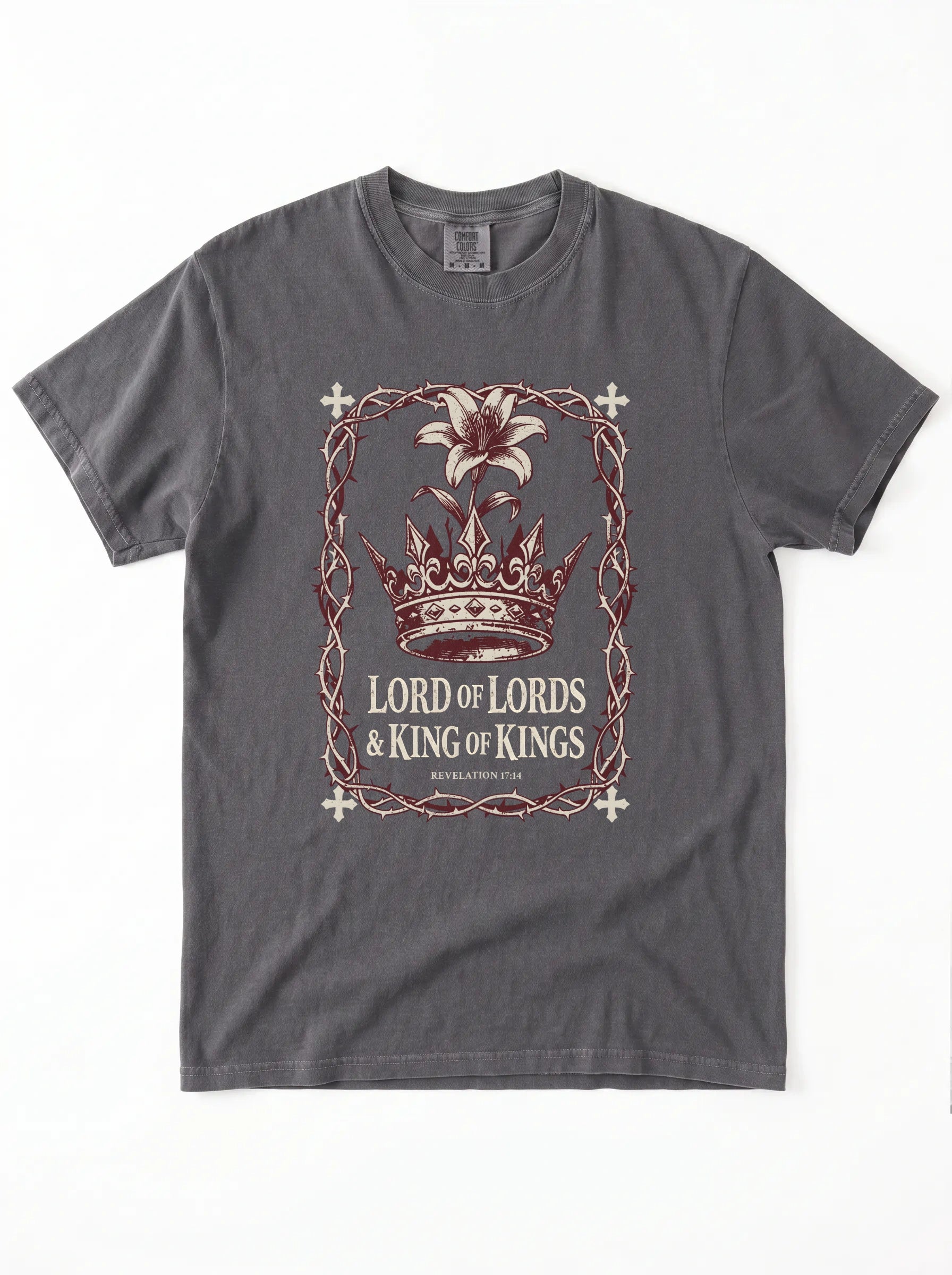 A dark gray crewneck t-shirt featuring a graphic print of a crown, a lily flower, and the text 'LORD OF LORDS & KING OF KINGS' in a distressed, vintage-style design.