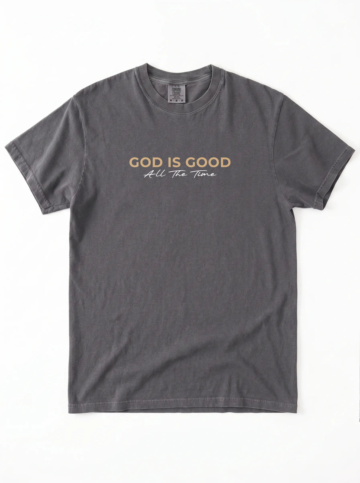 Charcoal grey “God Is Good All The Time” Christian graphic T-shirt laid flat on white background.