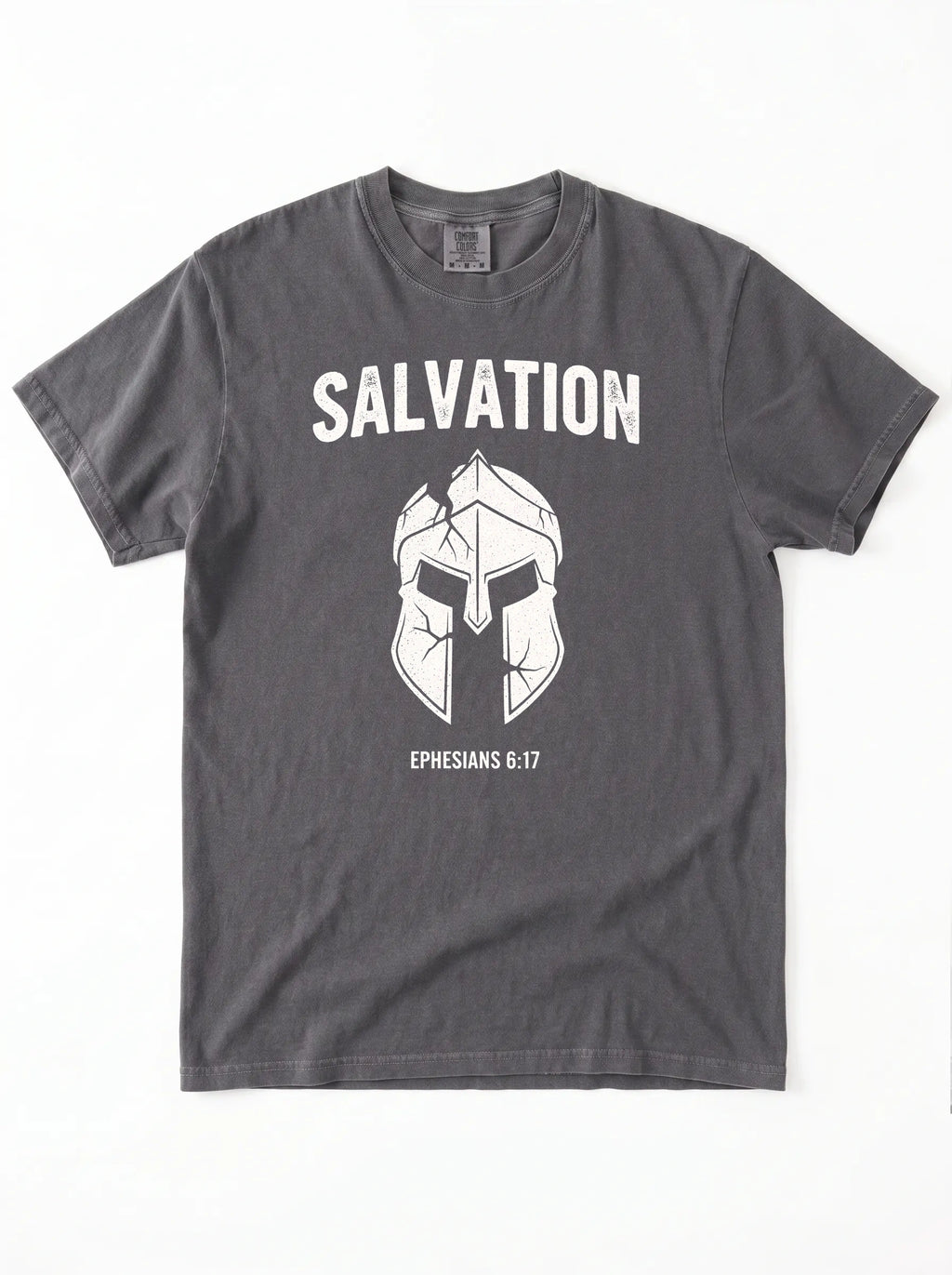 A dark gray crewneck t-shirt with a white graphic print featuring the word 'SALVATION' above a Spartan helmet illustration and the bible verse 'EPHESIANS 6:17'.