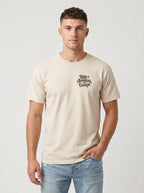 Man wearing cream Comfort Colors t-shirt with small 'His Approval Is Enough' faith graphic on left chest