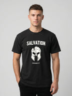 A man wearing a black crewneck t-shirt with a white graphic print of a helmet and the text 'SALVATION' and 'EPHESIANS 6:17'.