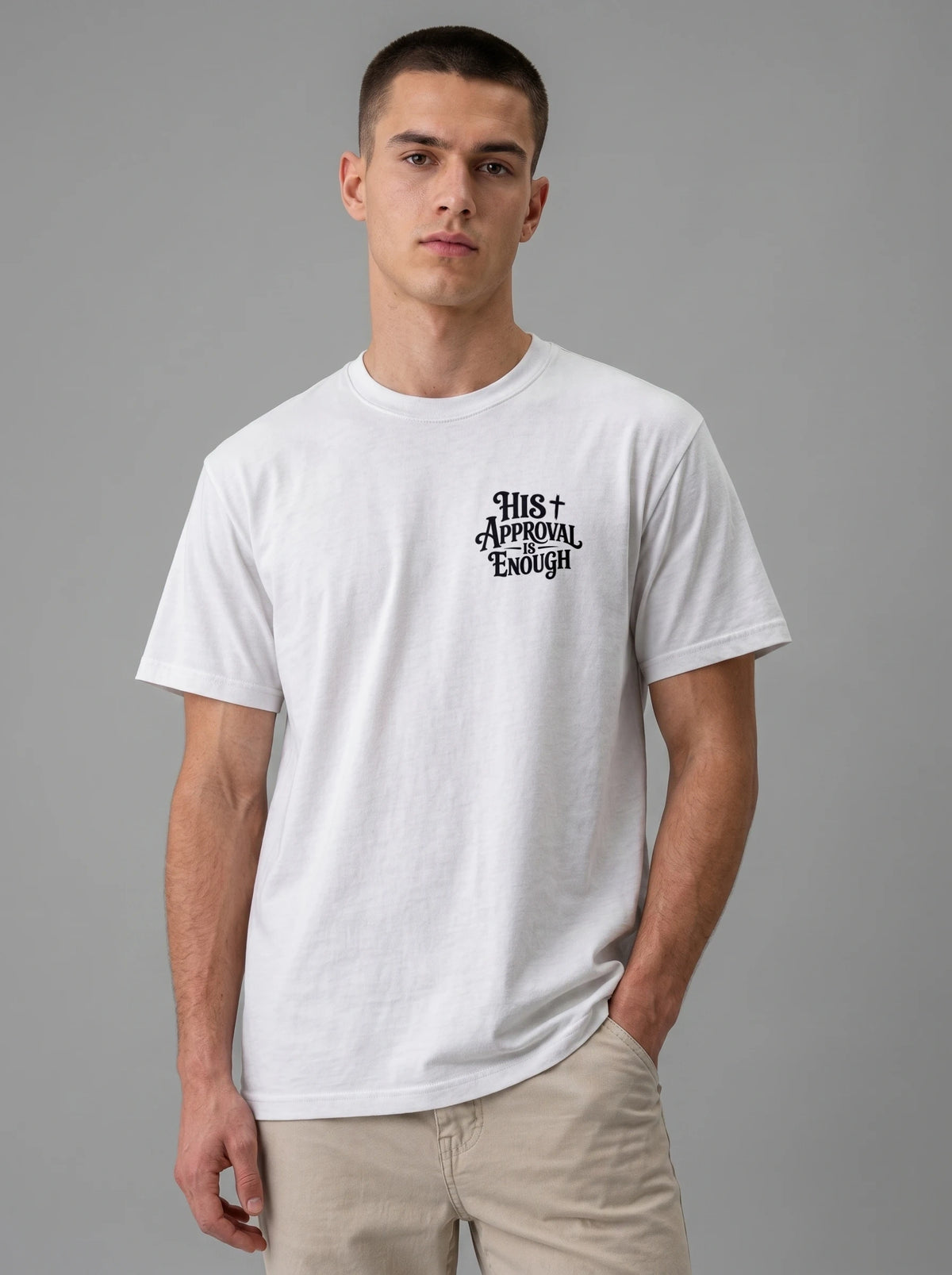 Man wearing white Comfort Colors t-shirt with small 'His Approval Is Enough' faith graphic on left chest