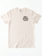 Flat lay of cream Comfort Colors garment-dyed t-shirt with 'His Approval Is Enough' chest print, front view