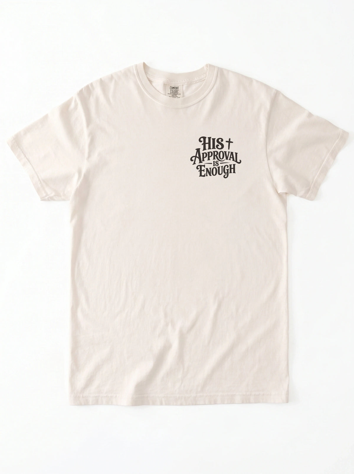 Flat lay of cream Comfort Colors garment-dyed t-shirt with 'His Approval Is Enough' chest print, front view
