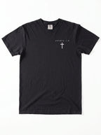 A black short-sleeve crewneck t-shirt with a small white Christian cross printed on the left chest, displayed flat against a white background.