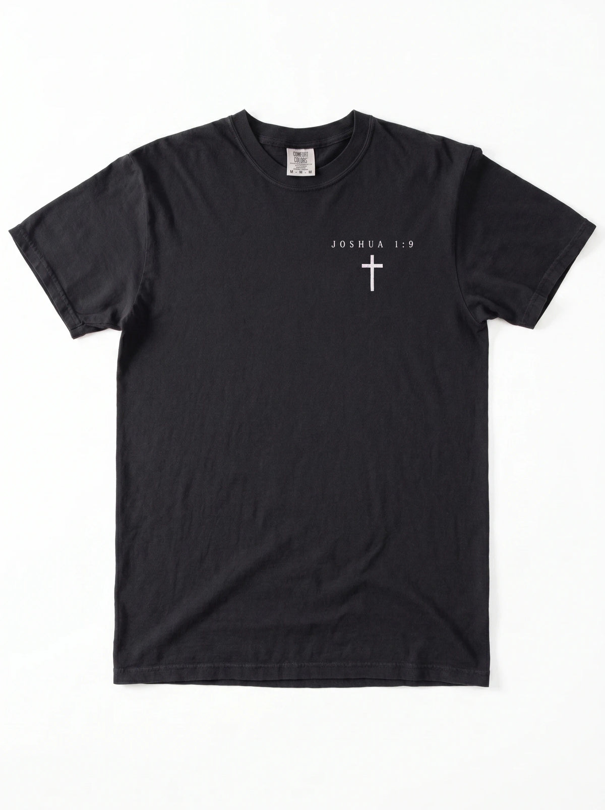 A black short-sleeve crewneck t-shirt with a small white Christian cross printed on the left chest, displayed flat against a white background.