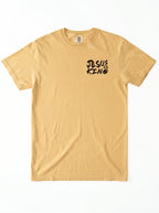 A light tan crewneck t-shirt with a black graphic print on the left chest reading 'JESUS IS KING' in a stylized hand-drawn font, displayed flat against a white background.