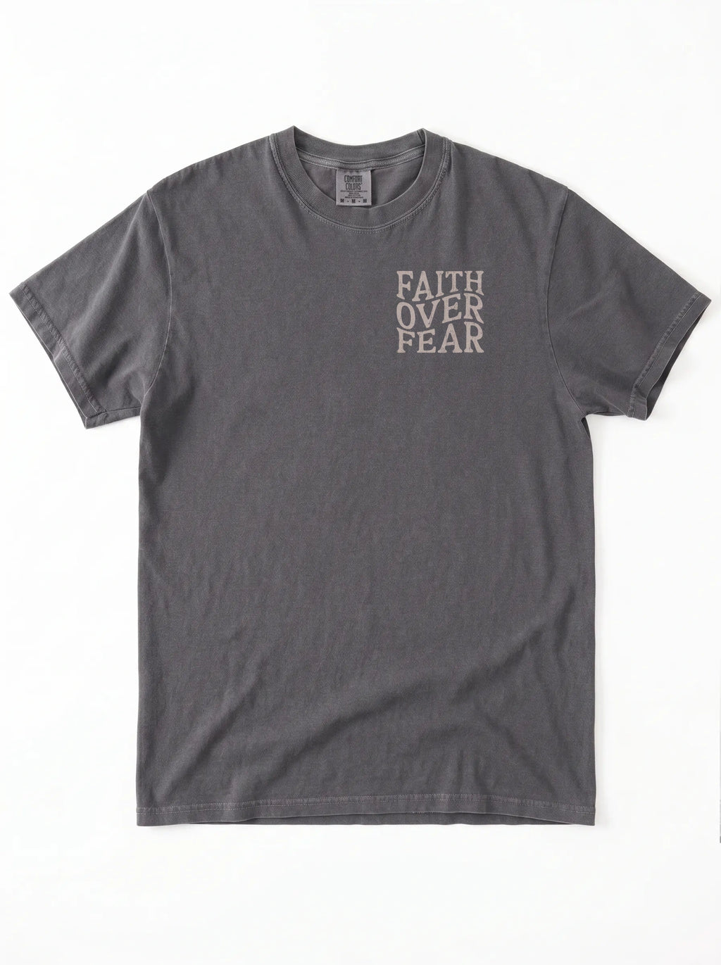 A dark gray short-sleeve t-shirt with the words 'FAITH OVER FEAR' printed vertically in a light beige font on the left chest, displayed flat against a white background.